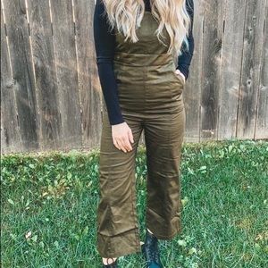 Cropped overalls in dark olive green.
